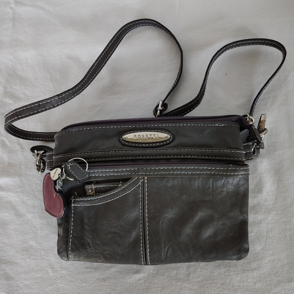 Rosetti Black Crossbody Bag with Adjustable Strap and Metal Emblem